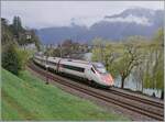 Der SBBETR 610 014 ist als EC 32 auf der Fahrt von Milano nach Genève und fährt bei Villeneuve dem aufgewühlten Genfer See entlang.