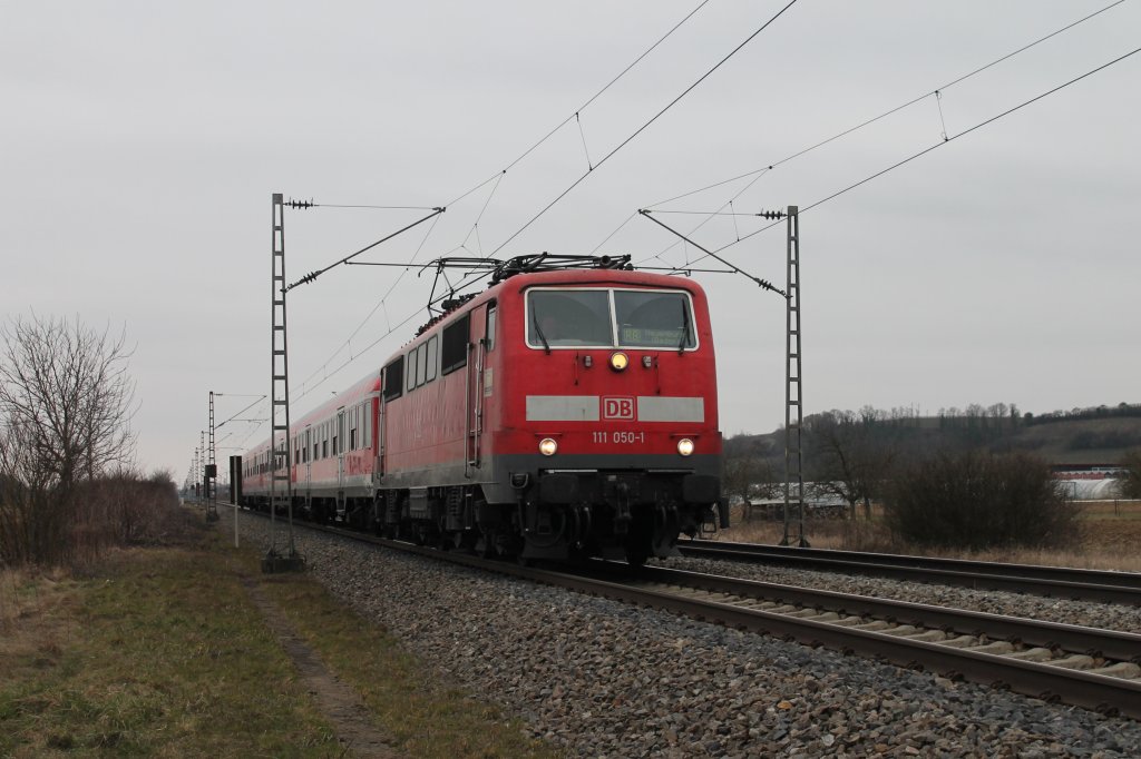 111 050-1 mit einer RB nach Neuenburg (Baden) am 02.03.2013 kurz vor Mllheim (Baden).