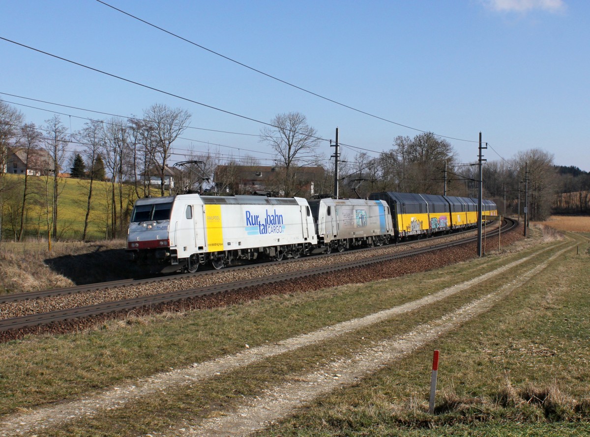 Die 185 637 und die 185 680 mit einem Autozug am 23.02.2014 unterwegs bei Kimpling.