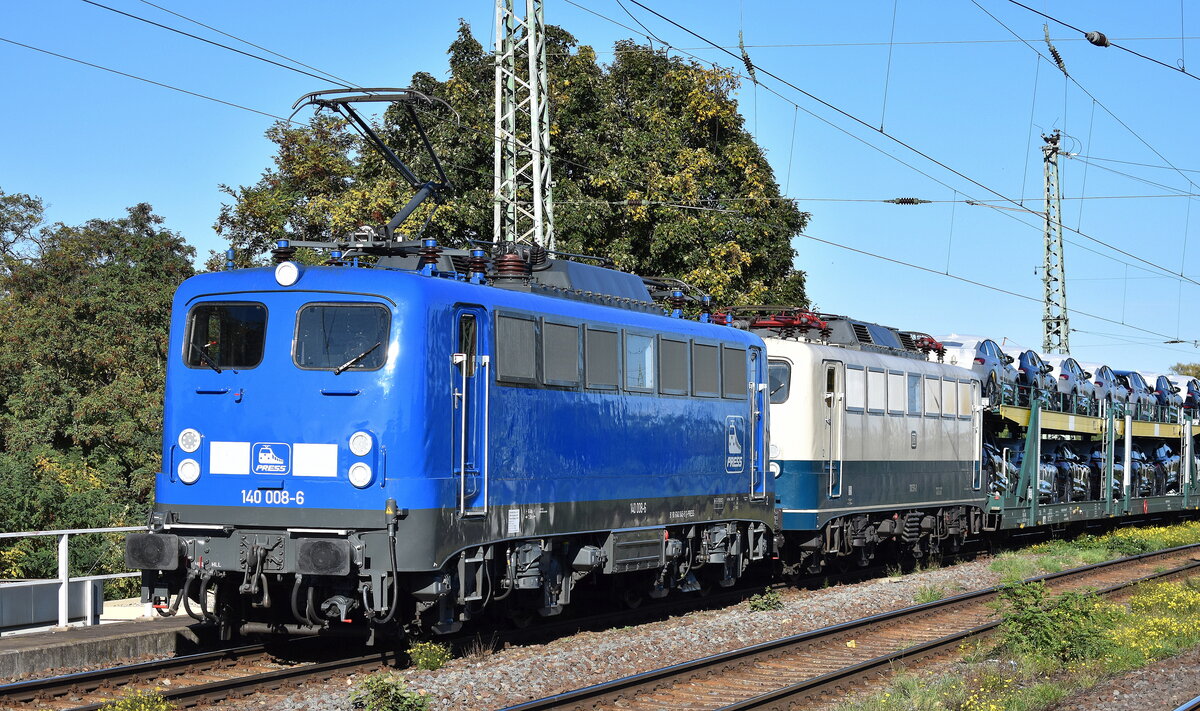 Eisenbahnbau- und Betriebsgesellschaft Pressnitztalbahn mbH, Jöhstadt (PRESS) mit ihrer  140 008-6  (NVR:  91 80 6140 845-9 D-PRESS ) und der schönen  110 511-3  (NVR:  91 80 6110 511-3 D-PRESS ) und einem PKW-Transportzug am Haken am 15.10.24 Höhe Bahnhof Magdeburg Neustadt.