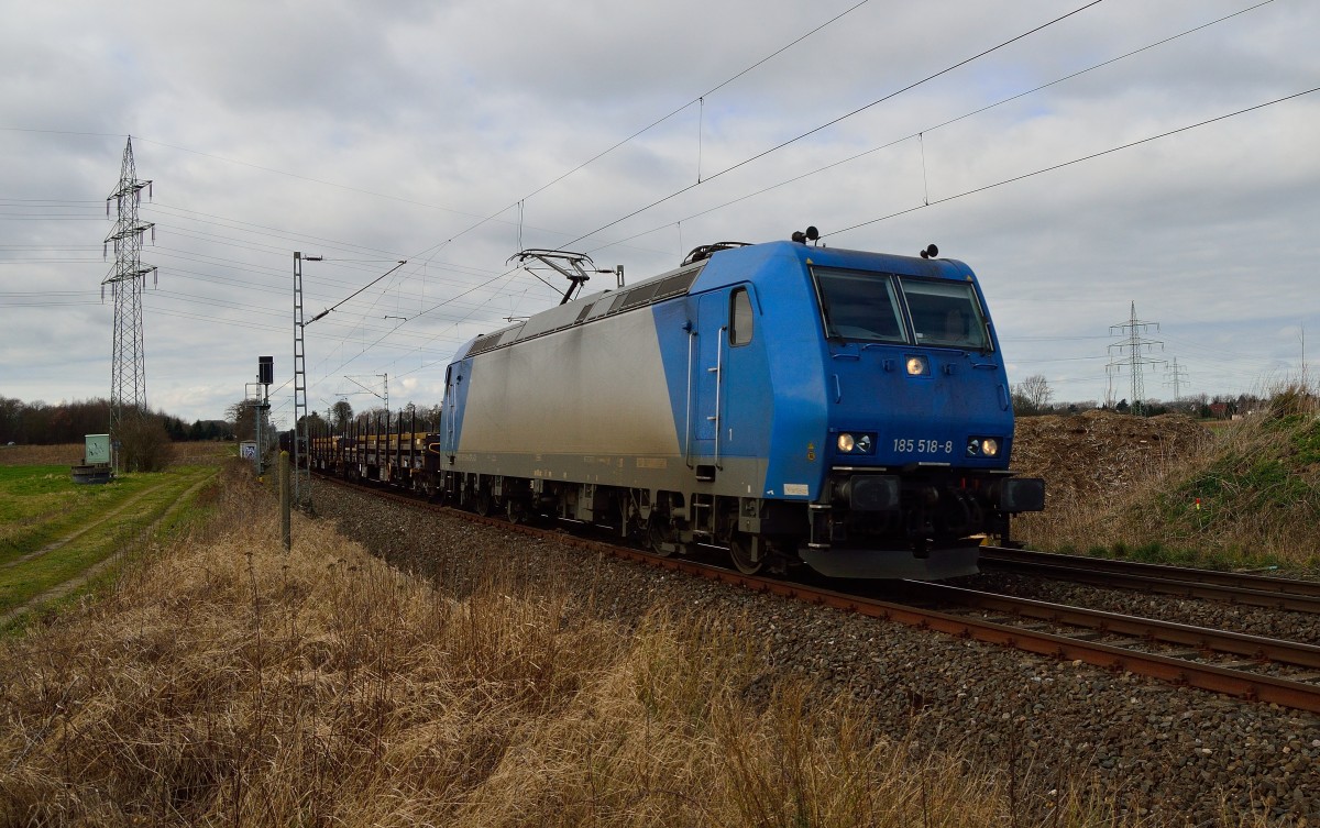 Mit einem Rungewagenzug voll Stahlprofilen ist die CFL 185 518-8 von Gubberath in Richtung Grevenbroich zu sehen am Sonntagmittag den 23.2.2014