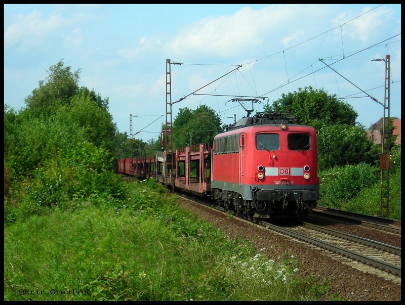 140 784 durchfhrt mit einem Leeren Autozug den Fotopunkt Limmer