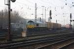 Die Class 66 von Ascendos Rail Leasing fhrt mit einem  P&O Ferrymasters Containerzug aus Brindisi(I) nach Muizen(B) bei der Ausfahrt von Aachen-West in Richtung Belgien bei Sonne am 30.1.2011.