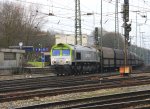 Die Class 66 6603 von Captrain fhrt mit einem Koksleerzug aus Bottrop nach Lttich-Seraing(B) bei der Ausfahrt von Aachen-West  am 9.3.2012.