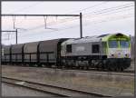 Eine Class-66 der Firma Captrain durchfhrt im Mrz 2012 Montzen Gare in Belgien,  am Haken ein Erzzug.Wohin die Reise geht kann ich leider nicht sagen.