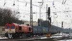 Die Class 66 DE6311  Hanna  von Crossrail fhrt mit einem Bulkhaul-Ganzzug aus Melzo(I) nach Zeebrugge-Ramskapelle(B) bei der Ausfahrt aus Aachen-West und fhrt in Richtung Montzen/Belgien im Schnee