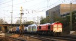 Die Class 66 DE6312   Alix  von Crossrail mit Akiem 76 002-9 dahinter kommt mit einem langen Containerzug aus Antwerpen(B) nach Italien und fhrt in Aachen-West ein in der Abendsonne am 18.4.2013.