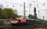 Die Class 66 DE6311  Hanna  von Crossrail fhrt mit einem sehr langen Dacia-Autozug aus Ciumesti(RO) nach Tongeren(B) bei der Ausfahrt aus Aachen-West und fhrt in Richtung Montzen/Belgien bei Wolken