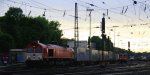 Die Class 66 DE6312  Alix  von Crossrail fhrt mit einem langen Containerzug aus Novara(I) nach Genk-Zuid-Haven(B) bei der Ausfahrt aus Aachen-West und fhrt in Richtung Montzen/Belgien in der