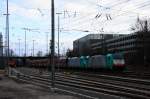 Zwei Cobra 2819 und 2840  kommen mit einem langen Kalkzug aus Yves-Gomezée(B) nach Millingen und fahren in Aachen-West ein bei Sonne und Regenwolken am Nachmittag vom 9.2.2014.