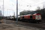 Die Class 66 DE6312  Alix  von Crossrail kommt aus Richtung Montzen/Belgien mit einem Kurzen Silozug aus Herentals(B) nach Buna-Werke(D) und fährt in Aachen-West ein bei Sonne und Regenwolken am