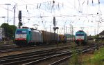 Die Cobra 2826 fhrt mit einem Containerzug von Aachen-West nach Belgien.Und im Hintergrund steht die Cobra 2818 mit eienem Kohlenleerzug bei Sonnenschein und Wolken am 8.7.2012.