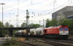 Die Class 66 DE6310  Griet  von Crossrail kommt aus Richtung Montzen/Belgien mit einem Kurzen Silozug aus Herentals(B) nach Poznen(PL) und fhrt in Aachen-West ein bei Sonne und Wolken am 28.4.2013.