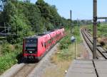 DSB S-Bahn Kopenhagen: Eine Garnitur der Linie F (LHB/Siemens-SH 4709) erreicht am 24. Juli 2014 den Haltepunkt Bispebjerg.