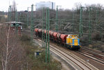 DB Bahnbau 203 301 mit leeren Schüttgutwagen in Köln West, fotografiert am 28.03.2008.