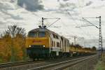 218 287-1 mit einen leeren Schienentransportzug am 24.10.13 Richtung Norden.