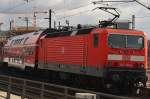 Hier 143 931-4 mit einer RB14 von Nauen nach Berlin Schönefeld Flughafen, bei der Ausfahrt am 25.2.2012 aus Berlin Hbf.