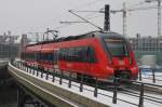 Hier 442 825 als RE7 (RE18716) von Bad Belzig nach Wünsdorf-Waldstadt, bei der Ausfahrt am 10.3.2013 aus Berlin Hbf.