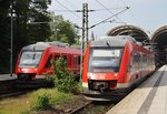 Whrend 648 332-4  Aumhle  als RB75 (RB21272) nach Rendsburg den Kieler Hauptbahnhof verlsst, wartet 648 854-7 auf Ausfahrt ins BW. Dieser Triebzug kam als RE72 (RE21927) aus Flensburg nach Kiel. (30.5.2016)