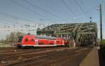 Die DB Regio RE1 von Paderborn nach Aachen fhrt mit Ihre Doppelstock von Hohenzollern Brcke in richtung Kln Hbf am 28 04 2012.