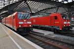 146 260 trifft am 25.05.2019 mit dem RE5 (RE28532)  Rhein-Express  von Koblenz Hauptbahnhof nach Wesel im Kölner Hauptbahnhof auf die Freiburger 146 219-1.