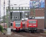 423 251-8 und 423 296-3 als S11 aus Dsseldorf Flughafen Terminal nach Bergisch Gladbach und 143 237-6 aus Essen nach Kln Nippes bei der Ein- bzw. Ausfahrt in Kln Hbf, 23.7.10