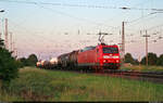 185 043-7 zieht zu späterer Stunde eine bunte Mischung aus Kessel- und Flachwagen durch den Bahnhof Röblingen am See Richtung Sangerhausen.