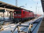 112 106 mit dem RE 33111 nach Lutherstadt Wittenberg am 04.Dezember 2010 in Rostock Hbf. 