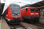 Treffen am 4.9.2016 im Rostocker Hauptbahnhof von einem RE5 (RE4367) nach Wünsdorf-Waldstadt mit 114 005 und 112 118 mit RE18491  Warnemünde-Express  von Warnemünde nach Berlin Lichtenberg.