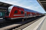 RE5 (RE4363) mit Schublok 114 040 von Rostock Hauptbahnhof nach Elsterwerda am 22.7.2016 in Rostock Hauptbahnhof.