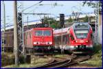 Ein Flirt hat Vorfahrt.... 155 131-6 & 155 020-1 (mit-45504- aus Seddin)
mssen dem RE nach Sassnitz, an der Ziegelgrabenbrcke, den Vortritt lassen.    Stralsund am 18.08.09