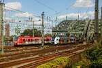 423 541-3 DB  Dr Zock kütt  Kölle & RRX 462 034 bei der Überquerung der Hohenzollernbrücke in Köln, August 2024.