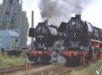 50 3695-9 und 41 1231-4 bei einer Parallelfahrt 1994 in Stassfurt.(Archiv P.Walter)