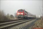 BR 218 252-5 fhrt mit einer Regional Bahn im Frhjahr 2003 auf dem Weg von Heide nach Itzehoe aus Meldorf.