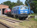 PRESS 218 055 schob,am 14.Juni 2024,die DB 218 390 zum Abstellen in den Lokschuppen in Bergen/Rügen.