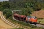 221 105 mit Schotterzug im Baugleis am 26.08.2011 bei Edlhausen