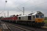 ECR 247 042 am Zugschluss eines Schrottzuges in Duisburg-Bissingheim.Die Lok fuhr als Bremslok mit.