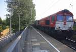 Die Class 66 PB12  Marleen  von Crossrail kommt mit einem langen Containerzug aus Ruhland(D) nach Antwerpen-Combinant(B) und fährt durch Kohlscheid in Richtung Richterich,Laurensberg,Aachen-West. 
An einem schönem Sommermorgen vom 12.6.2015.