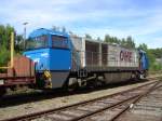 MaK 2000BB der OHE vor einem Holzzug der am Nachmittag des 01.08.07 im Bahnhof Arnsberg (Westf.) beladen wird.