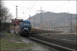 Eine OHE G2000 durchfhrt mit einem Holzzug den ehemaligen Bahnhof Westhofen.