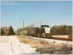 Die mit MRCE 500 1571 beschriftete MaK1206 von Veolia zieht hier im schnsten Winterlicht ihren Quarzsand-Behlterzug von Torgau nach Hosena durch die Niederlausitzer Heidelandschaft sdlich von Falkenberg/Elster.