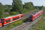 Auf der kurz zuvor begonnenen Fahrt von Aulendorf nach Stuttgart als IRE 3266 fhrt 612 569 an zwei 650ern vorbei, die sich auf der Sdbahn auf Rangierfahrt befinden. Aulendorf, 21.08.2017.