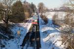 628 639-7 steuert, von München kommend, am 06.01.15 gerade Thann-Matzbach an. Auch die Sonne befreite sich von den letzten Wolkenmassen, die in Richtung der Alpen zogen.