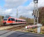 644 017 kam am 2.3.16 als RB38 von Neuss kommend über den Bahnübergang Blumenstraße in Grevenbroich gefahren. 

Grevenbroich 02.03.2016