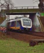 Unter der Stadtbahnunterfhrung bei Osterath Grgesheide kommt der MWB Triebwagen 648 420 und im Anhang den 648 429 als RE10 nach Dsseldorf hindurch gefahren. 23.3.2013