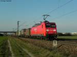 25.03.2011: Die 145 033-7 mit einem Containerzug Richtung Sden. Aufgenommen bei Graben-Neudorf.