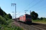 145 035-2 fuhr am 07.07.2012 mit einem Gterzug von Osnabrck nach Emden, hier bei Neermoor.