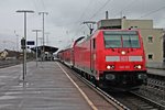 Ausfahrt am 17.01.2015 von der Stuttgarter 146 201, die an das BW Freiburg seit dem Sommer 2014 ausgeliehen ist, mit einem RE (Offenburg - Basel Bad Bf) aus dem Bahnhof von Müllheim (Baden).