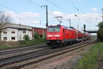 Ausfahrt am 18.04.2015 von der Freiburger 146 230-8  Radolfszell  mit einem RE (Basel Bad Bf - Offenburg) aus dem Bahnhof von Müllheim (Baden) gen Norden.