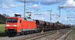 DB Cargo AG, Mainz mit ihrer  152 145-9  [NVR-Nummer: 91 80 6152 145-9 D-DB] und einem Ganzzug Schüttgutwagen am 18.04.24 Höhe Bahnhof Rodleben.